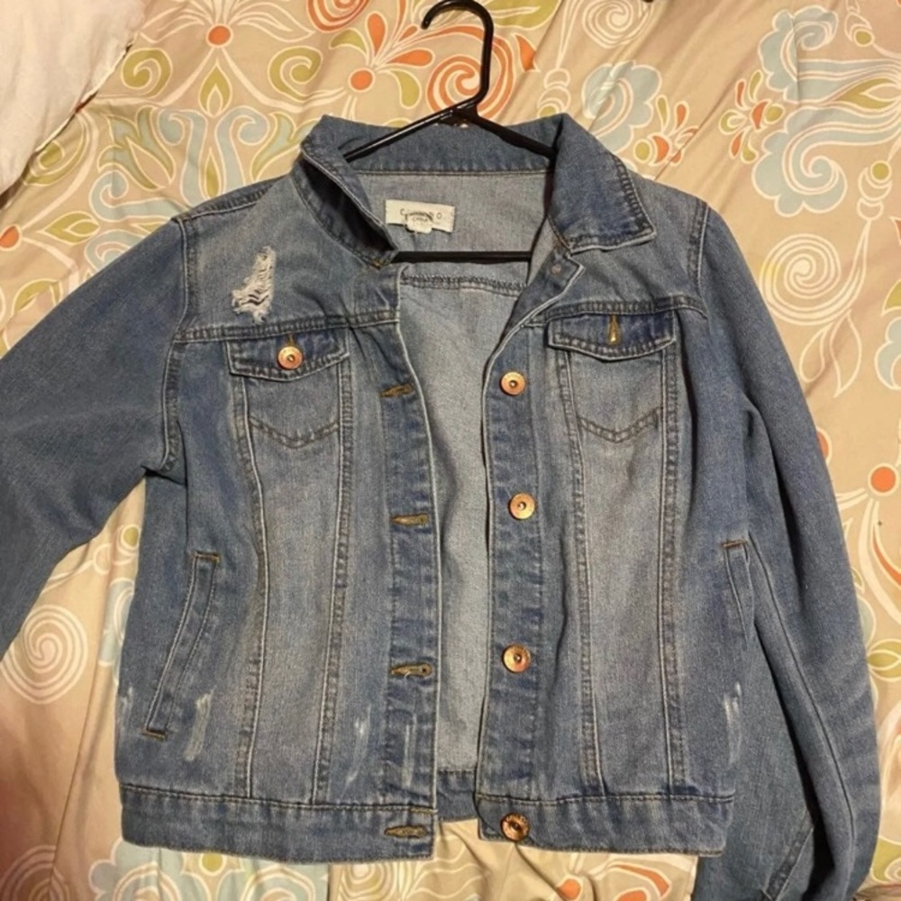 Distressed denim jacket